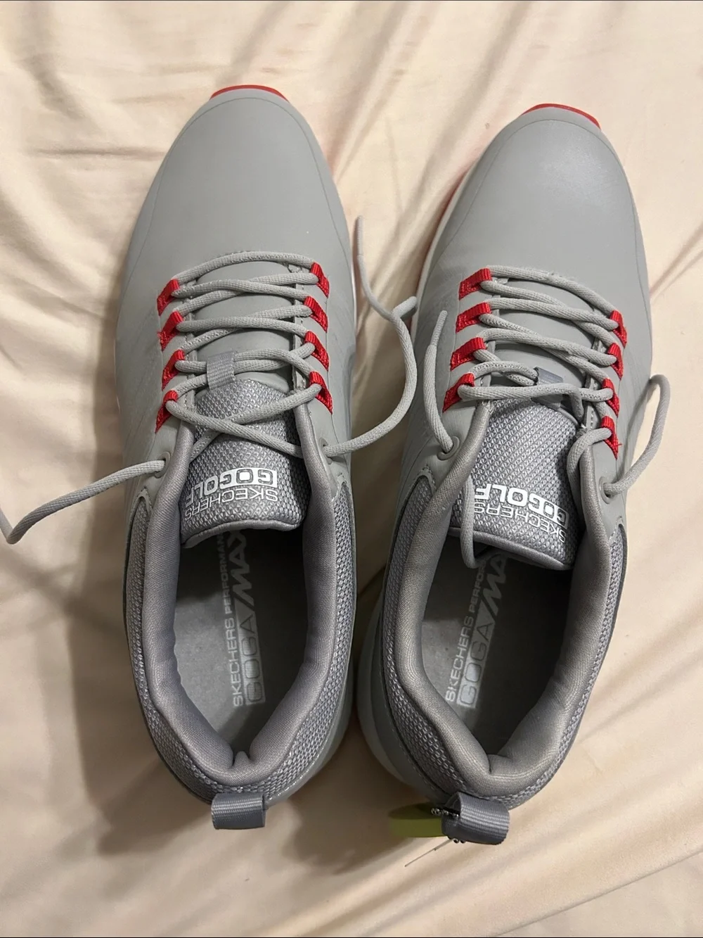 Skechers Men’s Light Gray Sneakers with Red Eyelet Accents